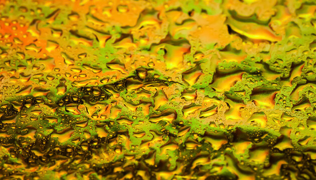 Drops of water on foil. Coloured wet abstraction. Macro photography