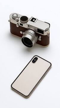Vintage analog camera and modern smartphone side by side on white background illustrating the evolution of photography and technology over time