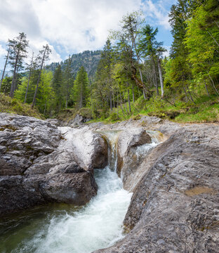 Bauernweissach stream near Kreuth, alpine landscape upper bavaria. green forest