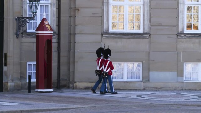 Royal Guard in red gala uniform at Amalienborg Palace, Copenhagen, Denmark