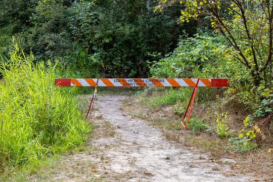 Closed Trail Barrier Blocking Path Through Marsh at Great Blue Heron Nature Reserve, Chilliwack, BC Canada