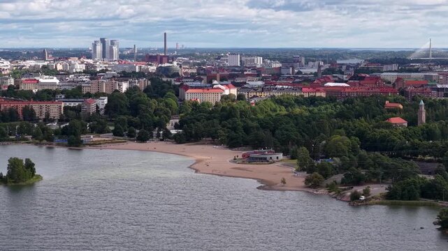 Flight over Hietaniemi Beach and Helsinki city skyline, Finland