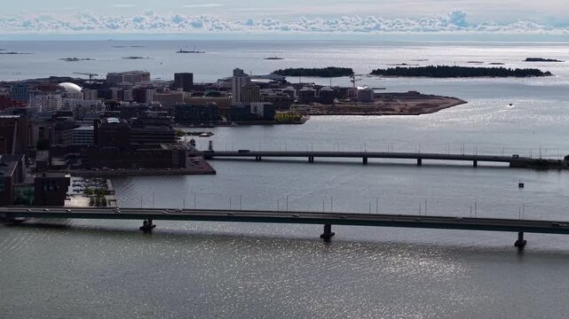 Flight over Salmisaari Bridges and urban waterways in Helsinki, Finland