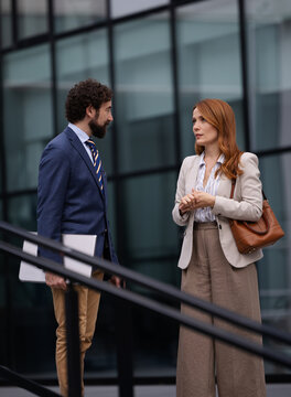 Business meeting outside a modern building