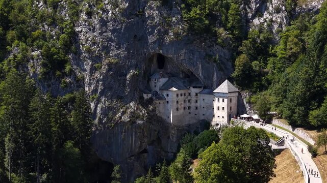 Flight past Predjama Castle, the world's largest cave castle, Slovenia