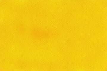 Fototapeta premium Vibrant yellow textured surface with soft grain effect for modern minimalist design projects