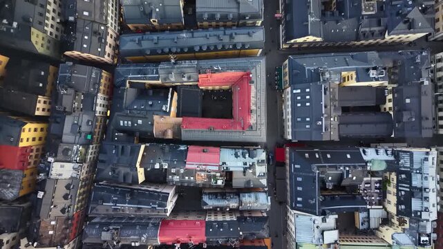 Top-down aerial shot of Gamla Stan medieval rooftops in Stockholm, Sweden