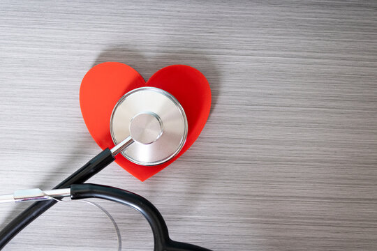 stethoscope on a computer keyboard, Heart shape with a stethoscope; cardiovascular health and heart health concept