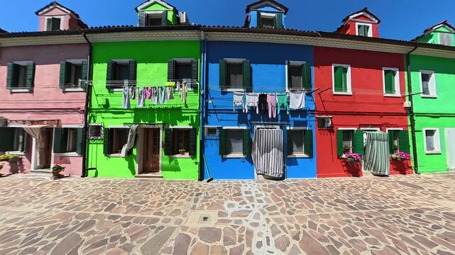 Colorful Burano Street with Vibrant Houses and Flowers in Venice Italy