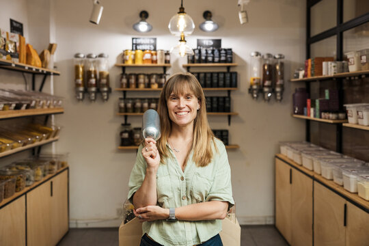 Smiling woman working in zero waste food store