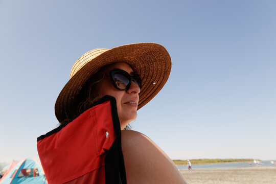 Woman relaxing under the sun at a beach