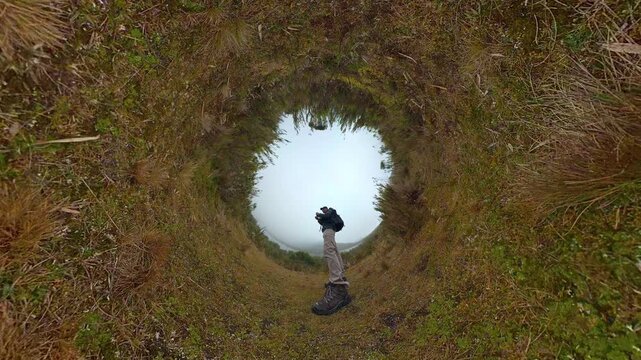 Hiker creating tiny planet effect in paramo