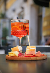 Plakat Vibrant orange Italian spritz cocktails with a charcuterie board, Sanremo, Italy