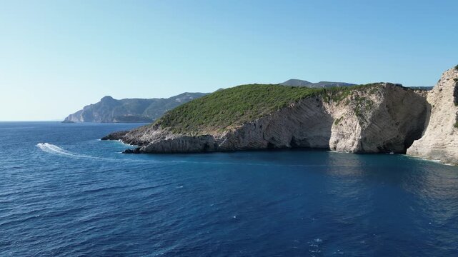 4K Aerial static view of Chomi Beach and surrounding coastline near Paleokastritsa, Greece