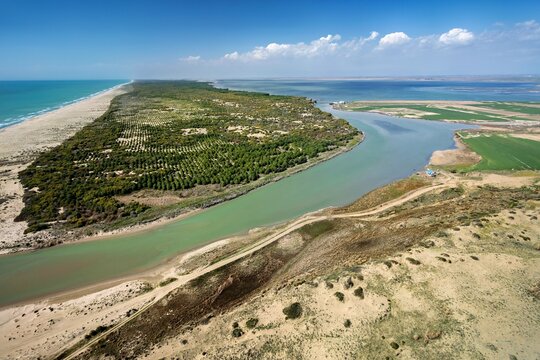 Aerial view of Lake Akyatan, showing the land strip separating the lake from the Mediterranean Sea, with dunes and fields in Karatas, Adana, Turkey.