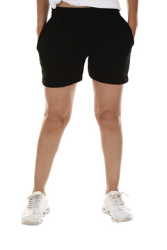 Woman wearing shorts in a white studio for e-commerce fashion