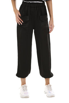 Woman wearing pants in a white studio for e-commerce fashion