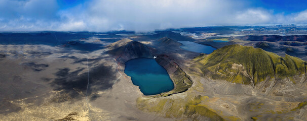 Aerial view of crater lake with moss-covered cone volcano, Rangarthing ytra Iceland © Earthly Shots
