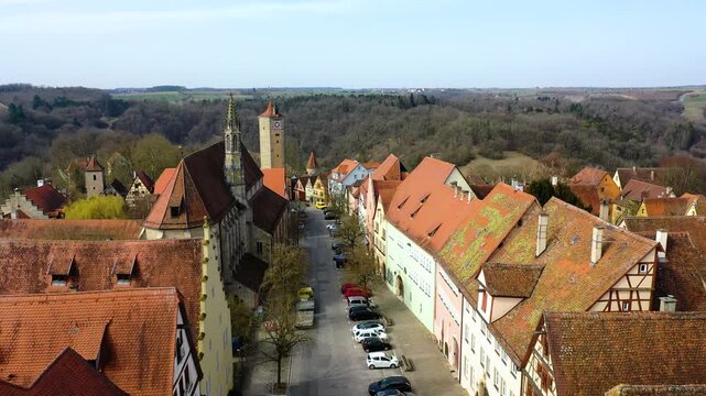 4K panoramic view of Rothenburg ob der Tauber, Germany, featuring historic rooftops, medieval towers, traditional houses and surrounding countryside.