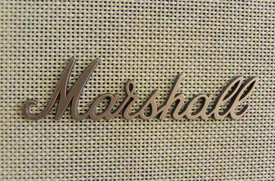 ZAPOPAN, MEXICO - AUGUST 25, 2026: Close-up of Marshall logo on a woven speaker grille fabric.