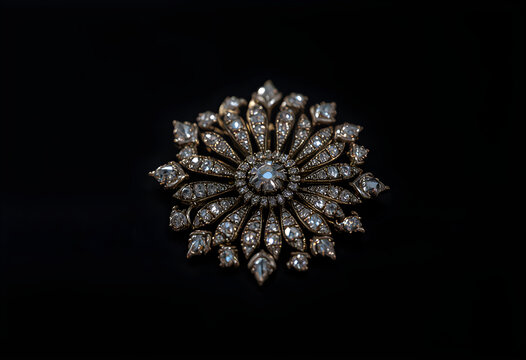 brooch, on black background, minimalist background, resting in soft light