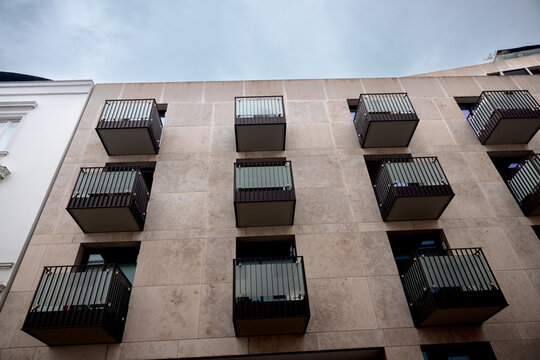 Hamburg, Germany - July 1, 2026: Modern apartment building with projecting black metal balconies in Hamburg, Germany.