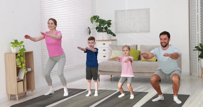 Happy family doing exercise together at home