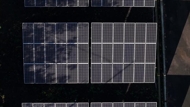 Aerial view of solar panels at the PLTS 1MWp Bangli solar power plant in Bangli, Bali, Indonesia.