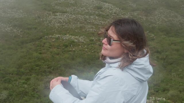 Woman enjoying the view in the foggy paramo mountains
