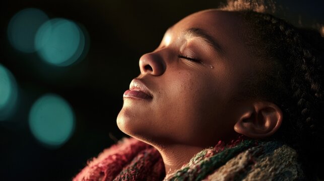 A young black woman with her eyes closed, head tilted back, wearing a colorful knitted scarf, against a dark with teal bokeh light circles