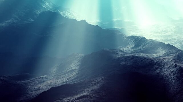 Beams of light coming down through the water. The view includes dark mountains under the ocean. The environment looks deep and mysterious.