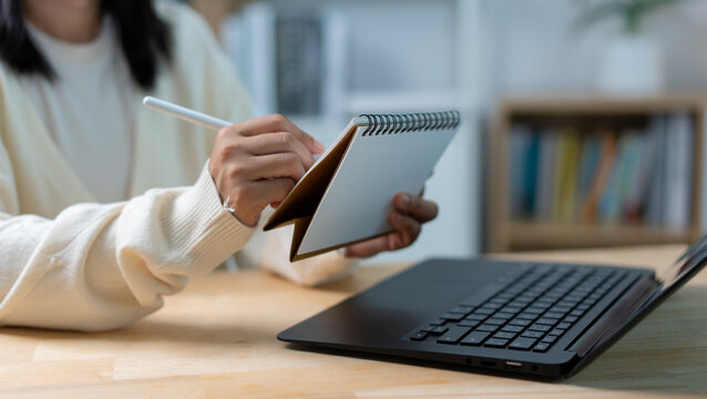 Woman Planning Schedule with Calendar, Tablet and Laptop