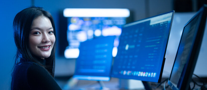 Programmer professional female working on software development, Asian IT developer coding for SaaS platform and cybersecurity network, Modern technology and computer programming business concept