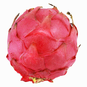 A whole vibrant pink dragon fruit featuring unique green-tipped outer scales, isolated cleanly on white.