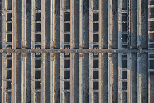Aerial view of the Cherokee Generating Station featuring industrial aeration tanks with bubbling water and concrete walkways, Denver, Colorado, United States.