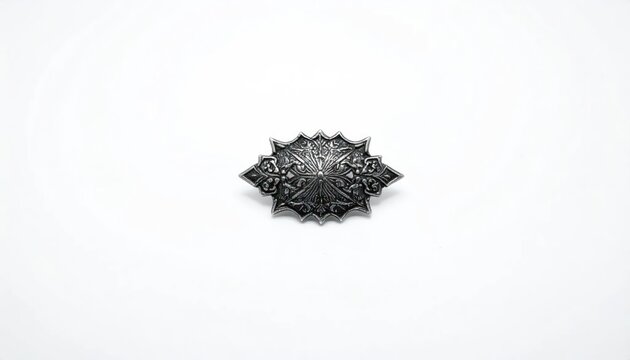 Isolated close-up of a silver-toned, symmetrical decorative object on a stark white background