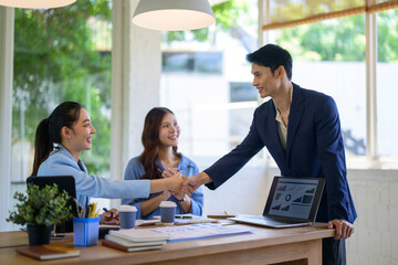 Business people handshaking after successful meeting deal © Apichat