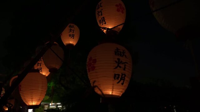 Traditional votive lanterns glowing at a Japanese shrine at night / 日本の神社で夜に灯る伝統的な献灯明 亀戸天神社