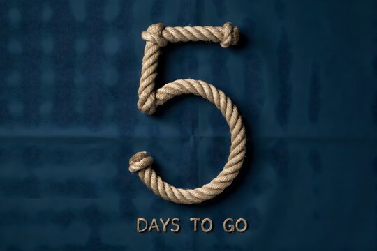 Number five made of rope for countdown timer, five days to go concept on blue background