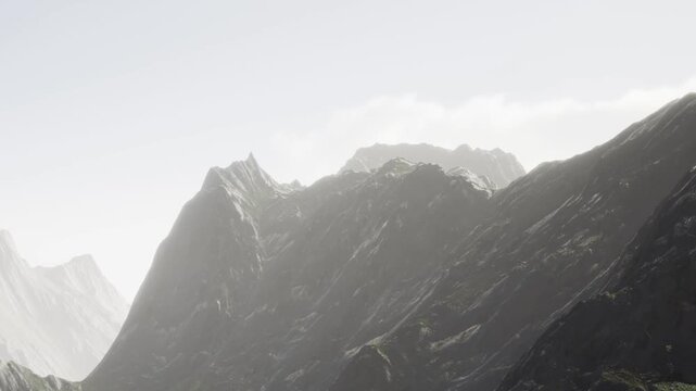 Tall mountains are visible in the afternoon. The light shines on the rocky surface, showing the details of the peaks. The sky is mostly clear with a few clouds.