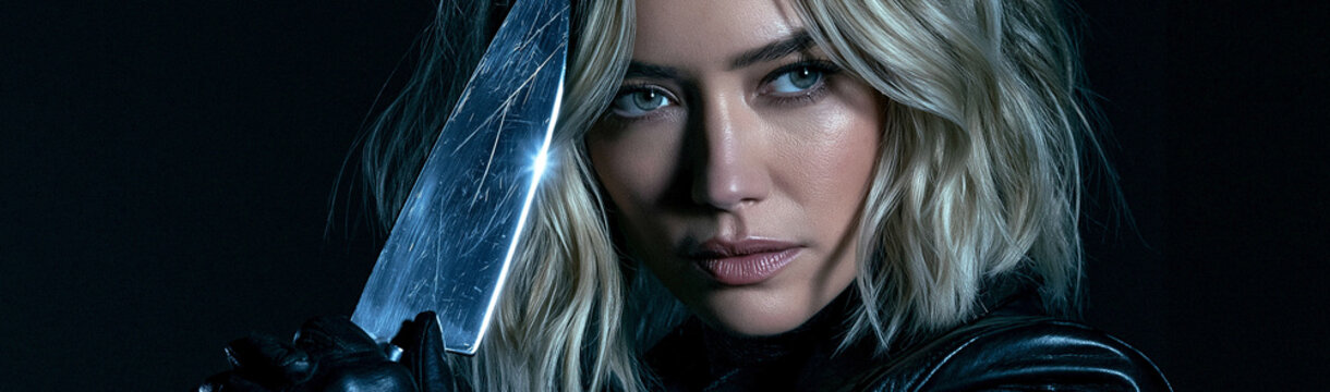 Mysterious Woman with Knife: A captivating woman with striking blue eyes and blonde hair holds a gleaming knife in a dramatic, dark setting, her gaze intense and alluring.
