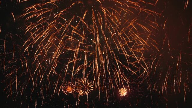 Close up of Dense Golden Fireworks Bursting in the Night Sky. Dense Frame festive background