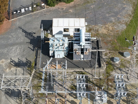 Ferntree Gully, Victoria, Australia - 24 August 2026: Aerial view of Ferntree Gully Zone Substation with electrical transformers and metal structures in a fenced industrial compound.