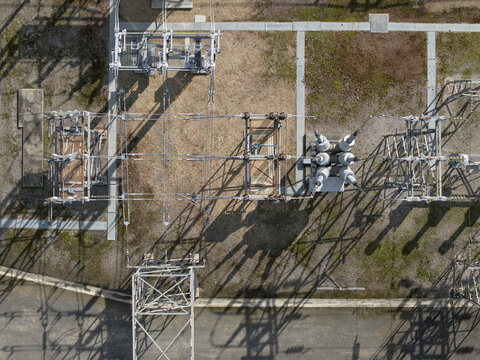 Ferntree Gully, Australia - 24 August 2026: Aerial view of Ferntree Gully Zone Substation featuring electrical transformers, metal infrastructure, and long shadows cast on the ground.