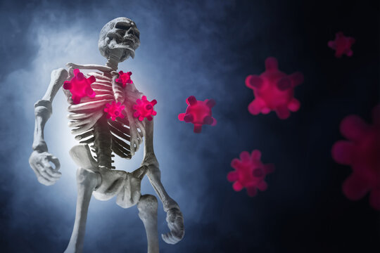 Human skeleton and red virus cells on dark smoke background