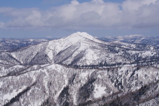Rugged snow-covered peak in northern Hokkaido in winter, Japan