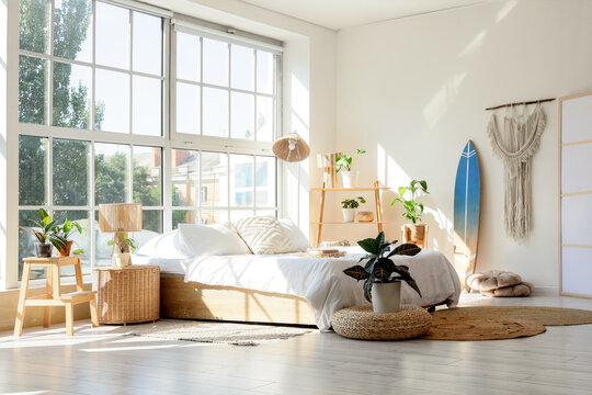 Bohemian bedroom interior design bright and airy space with natural light plants and a comfortable for relaxation