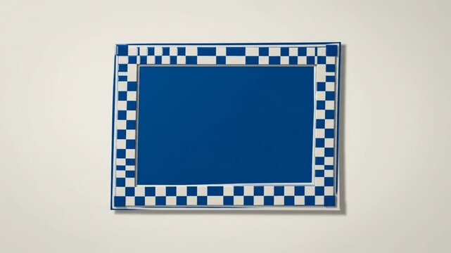 Blue Rectangular Frame Mockup with Checkered Border on Plain Neutral Wall Background