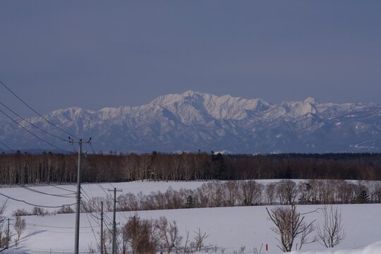 White winter mountain range seen from the edge of town, Hokkaido, Japan