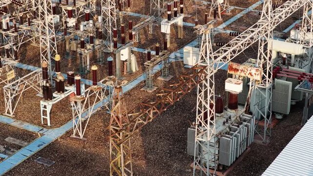 Aerial view of large power grid infrastructure distributing electricity during the afternoon